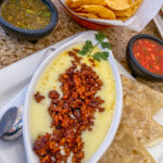 queso cheese in a bowl with a side of tortillas from Cabrera's Mexican Cuisine