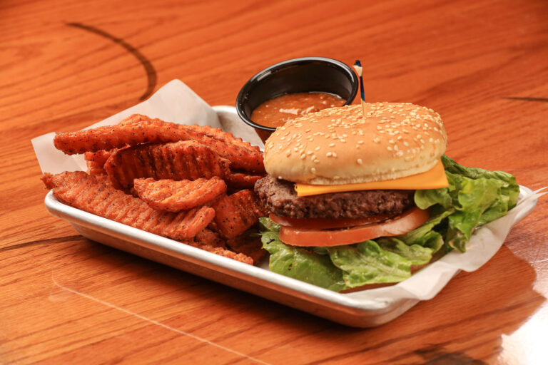 cheese burger on a platter with fries from Clearman's Galley
